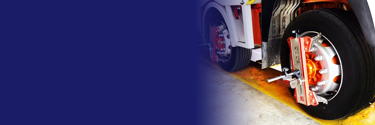 Truck wheel on alignment equipment